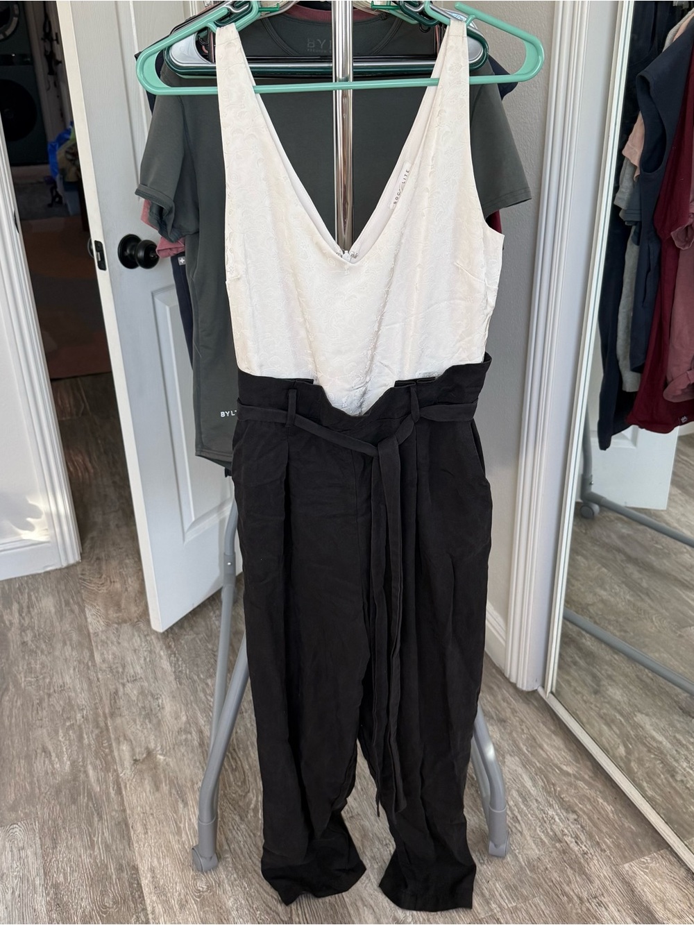 Socialite White Sleeveless V-Neck Jumpsuit with Black Tie-Waist Pants